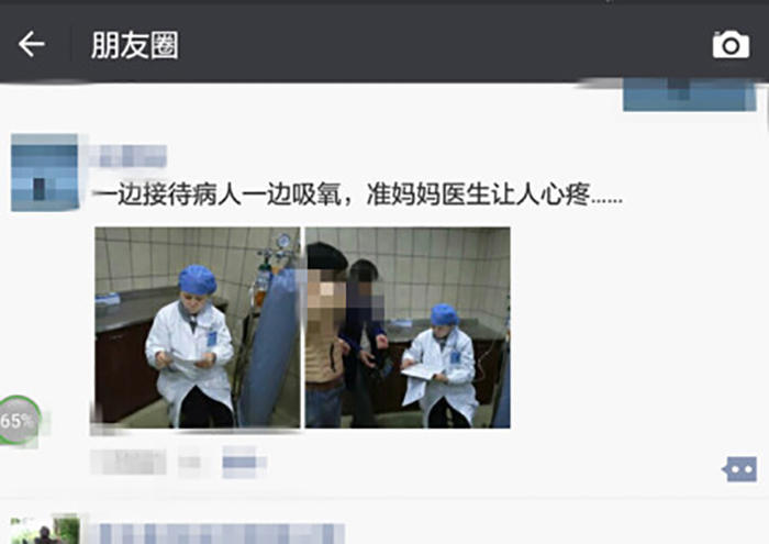 懷孕七月準媽媽醫生邊吸氧邊給人看病（圖）